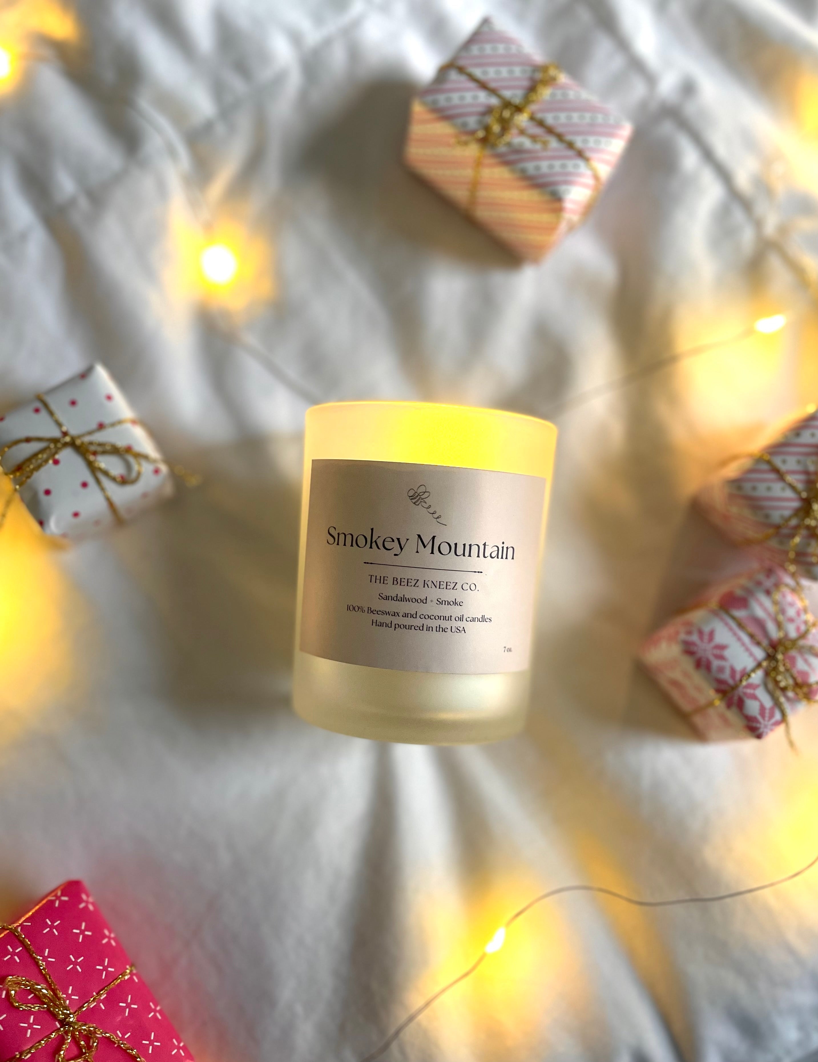 00% beeswax and coconut oil candle with sandalwood and smoke essential oil. Hand-poured non-toxic candles