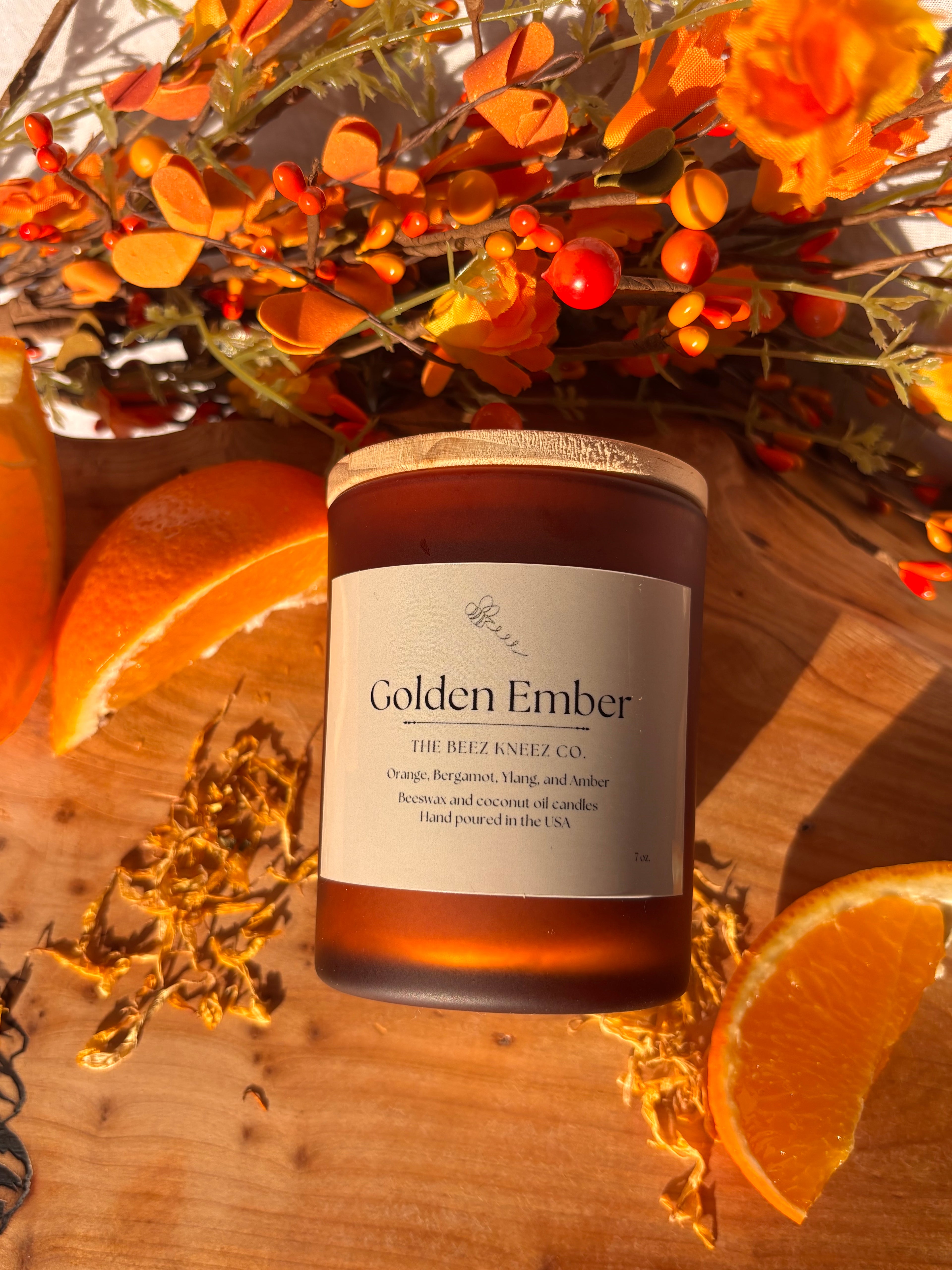 Golden Ember beeswax candle with amber essential oils, warm cozy glow.