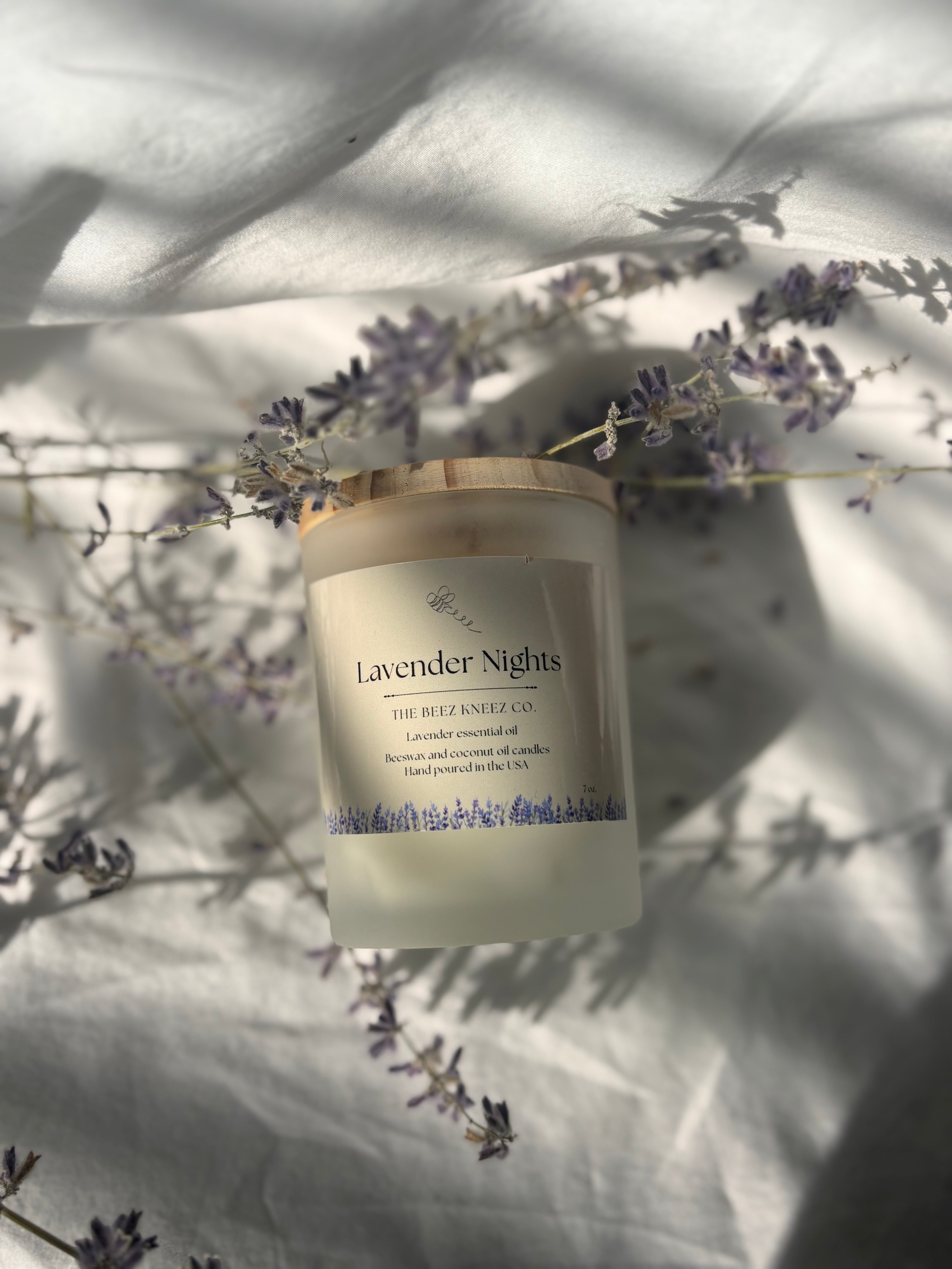 Lavender Nights beeswax candle infused with lavender essential oils. Dried lavender in the back 