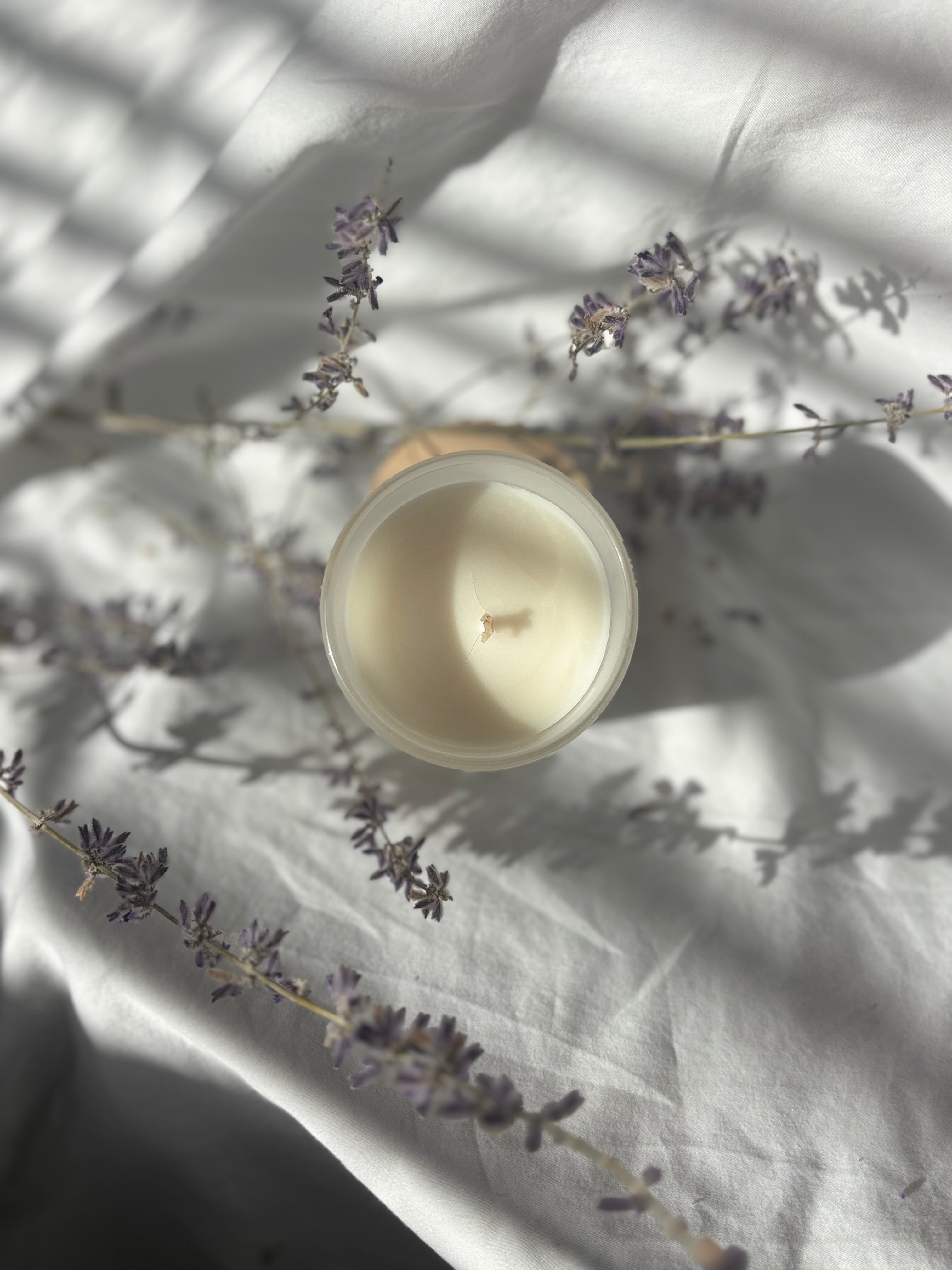 Lavender Nights beeswax candle infused with lavender essential oils. Dried lavender in the back 