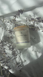 Lavender Nights beeswax candle infused with lavender essential oils. Video of candles with dried lavender in the back 