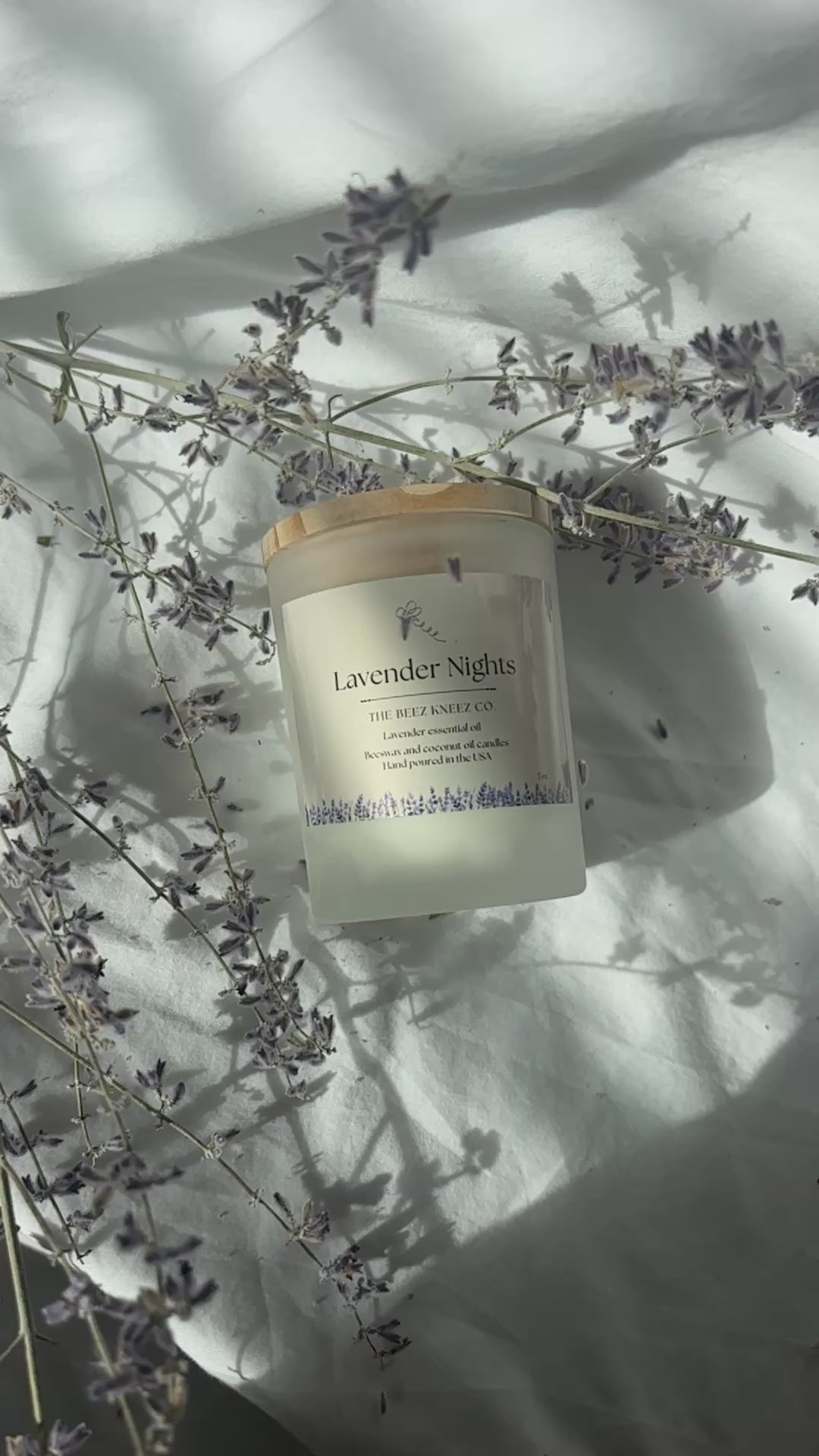 Lavender Nights beeswax candle infused with lavender essential oils. Video of candles with dried lavender in the back 